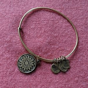 Gold Alex And Ani charm bracelet